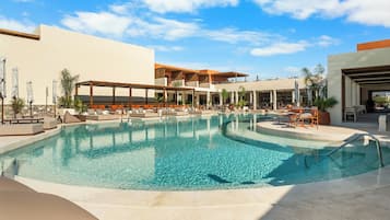 Seasonal outdoor pool, open 9:00 AM to 8:00 PM, pool umbrellas