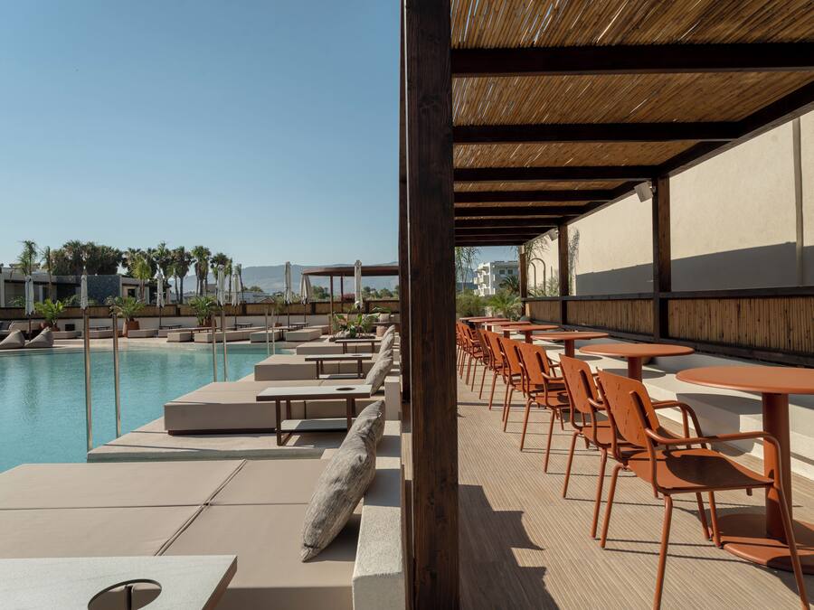 Seasonal outdoor pool, open 9:00 AM to 8:00 PM, pool umbrellas