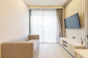 Apartment | Living area | Flat-screen TV - New Condo w Pool Gym Beach Nearby C247 (Choeng Thale)