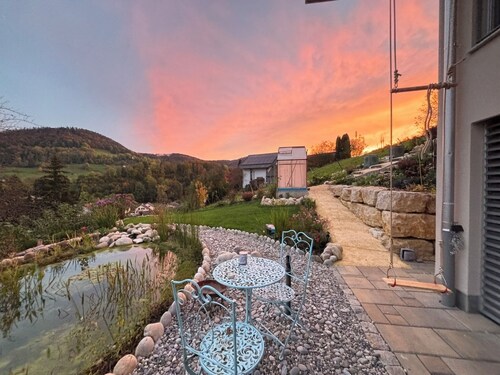 3 room apartment Villa Sonnglück by the natural swimming pond in the Swiss hiking Jura