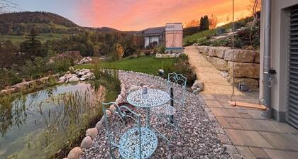 3 room apartment Villa Sonnglück by the natural swimming pond in the Swiss hiking Jura