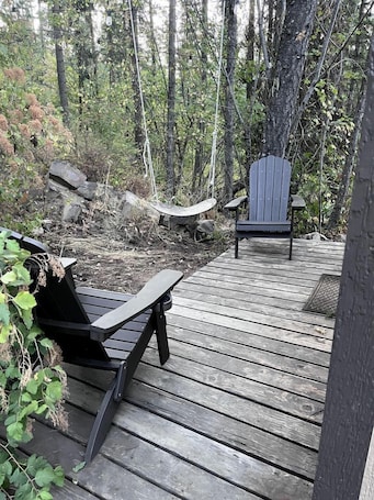 Terrace/patio. Cute Tiny House in the Woods for a Peaceful Getaway in Nature near Clark Fork, Idaho