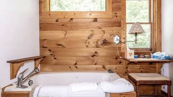 Jetted tub, hair dryer, towels, soap