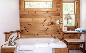 Jetted tub, hair dryer, towels, soap