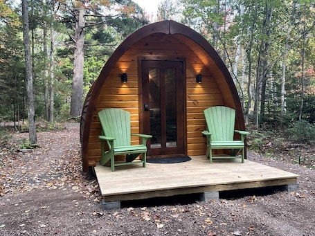 Terrace/patio. Luxurious White Pine Pod for Two Nestled in the Woods for an Unforgettable Glamping Getaway by Lake Superior in Wisconsin