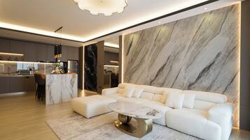 Presidential Suite, 1 King Bed, Partial Sea View | Living room | 50-inch LED TV with cable channels