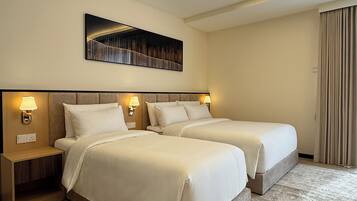 Deluxe Twin Room, Multiple Beds, Partial Sea View | Blackout curtains, iron/ironing board, free WiFi, bed sheets