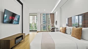 Apartment, 1 Bedroom, City View | Desk, laptop workspace, iron/ironing board, free WiFi