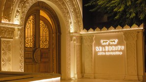 An ornate entrance with intricate carvings and a sign for the Celebrity Hotel Cappadocia. - Selebrity Cappadocia (Avanos)
