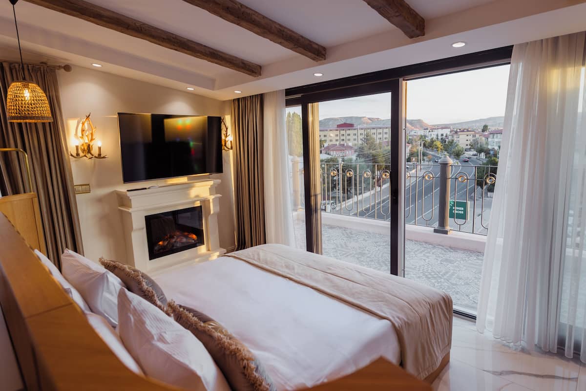 Deluxe Double Room, Balcony, City View | In-room safe, desk, laptop workspace, blackout drapes