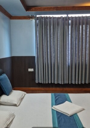 غرفة ديلوكس مزدوجة أو بسريرين منفصلين - منظر للحديقة | واي فاي مجانًا