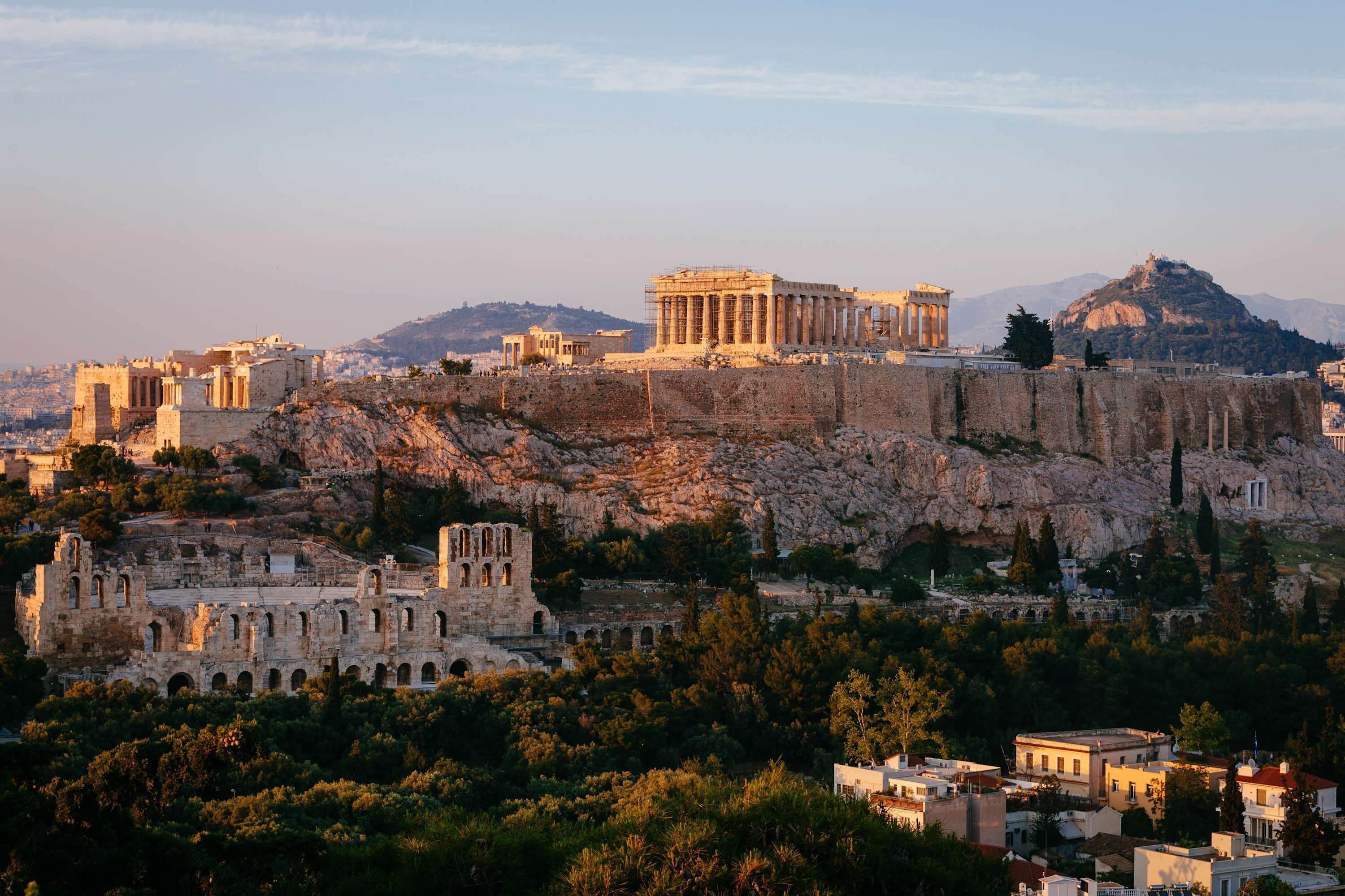 A historic site with ancient ruins, including a prominent temple and a large amphitheater.