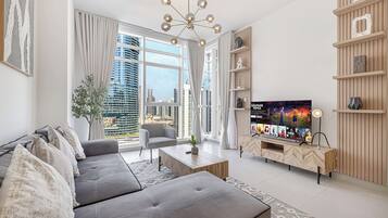 Luxury Apartment, Balcony, City View | Living area | 48-inch flat-screen TV with satellite channels