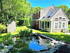 Property grounds - Three-bedroom house is nestled in a peaceful neighborhood and features a fully fenced yard. (Chatham)