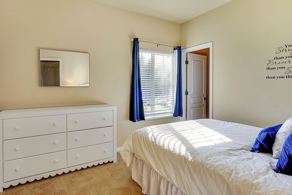 A bedroom with a bed, a dresser, a window with curtains, and a door. - Park City Area Lodge: 9 Mi to Timber Lakes (Heber City)