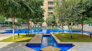 Outdoor pool, pool umbrellas, sun loungers