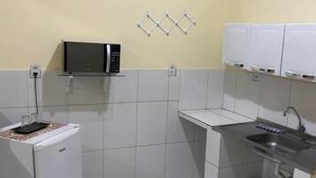 Mini-fridge, microwave, stovetop, cookware/dishes/utensils