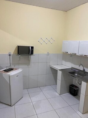 Mini-fridge, microwave, stovetop, cookware/dishes/utensils