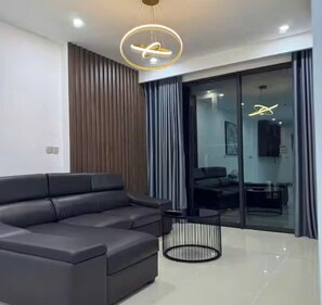 Family Suite, 3 Bedrooms, Club Lounge Access, City View | Living area | 65-inch Smart TV with cable channels, fireplace, Netflix - Miso Luxstay Ha Do Centrosa Residence (Hoa Hung)