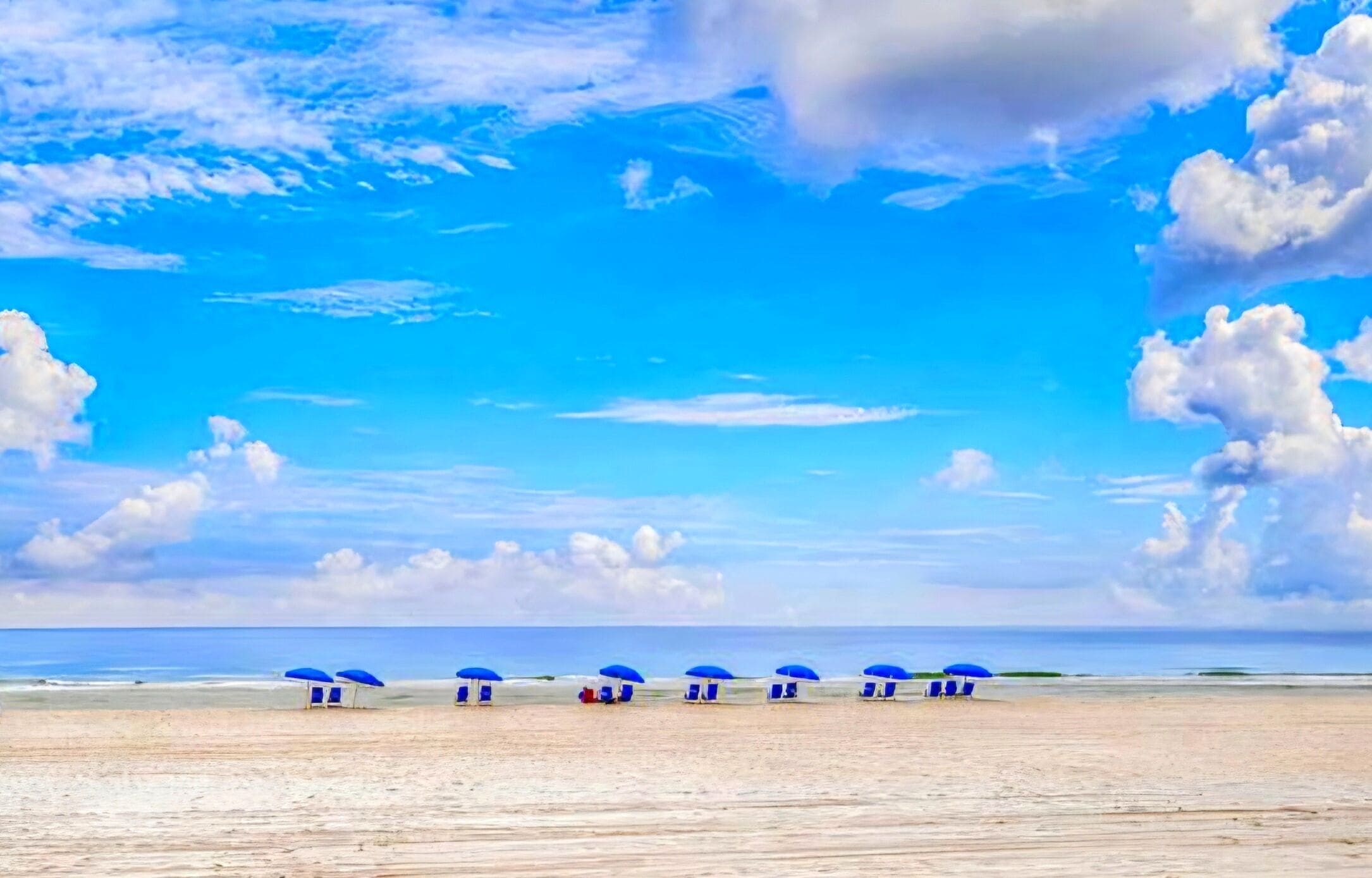 On the beach, sun-loungers