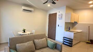 Suíte família, para não fumantes, vista para o mar | Área de estar