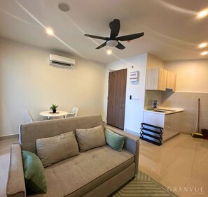 Suíte família, para não fumantes, vista para o mar | Área de estar