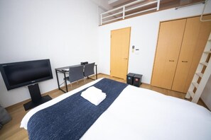 A hotel room with a bed, a desk, a television, and a wardrobe. - goom Hotel Nakasu Maxim (Fukuoka)
