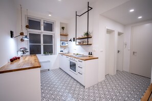 City Quadruple Room | Shared kitchen - Orange Glow Boutique Apartments #47 by goodnite cz (Brno)