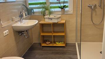 Shower, hair dryer, towels, soap