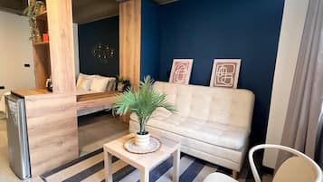 Estudio Deluxe, 1 cama matrimonial y sofá cama | Área de sala de estar