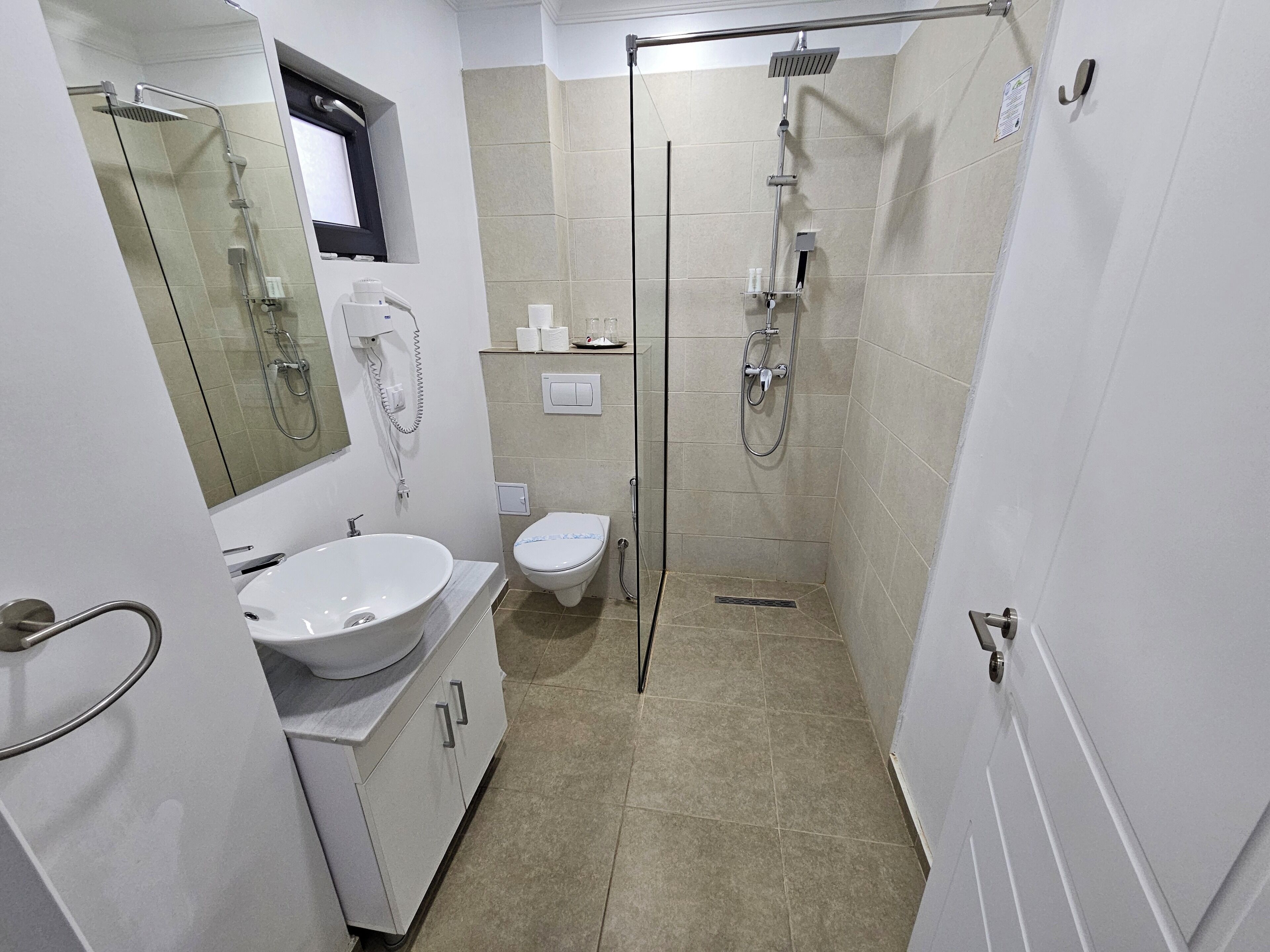 Shower, hair dryer, towels, soap