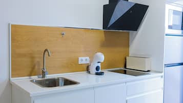 Deluxe Apartment, Pool View | Private kitchen | Full-size fridge, microwave, stovetop, dishwasher