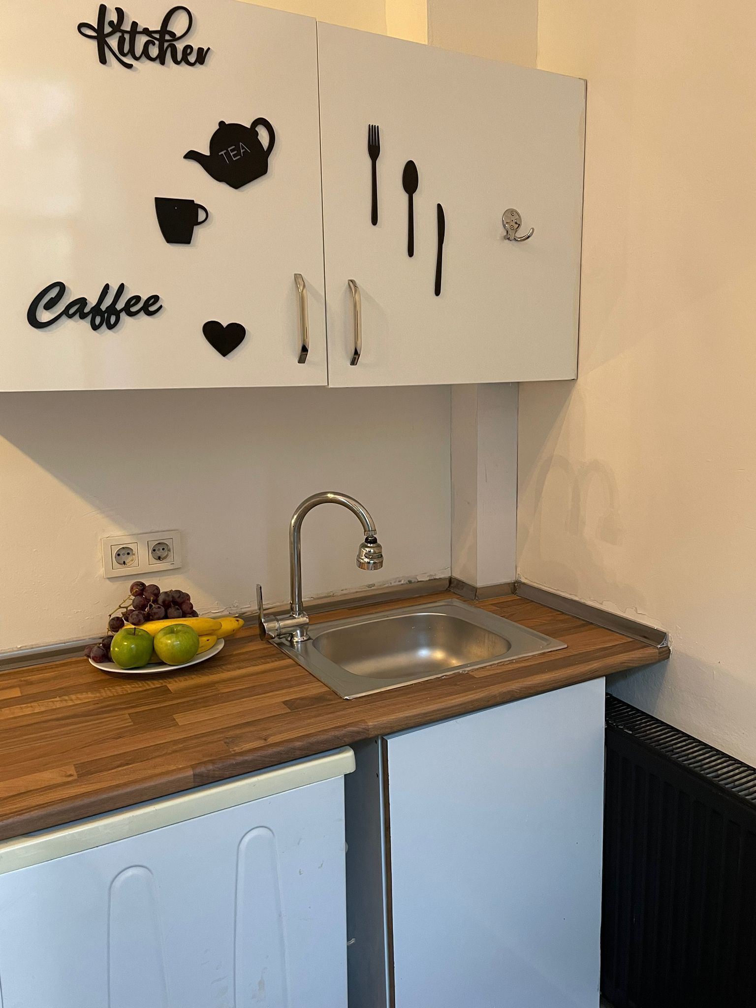 Mini-fridge, microwave, stovetop, cookware/dishes/utensils
