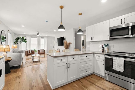 Fridge, microwave, oven, stovetop. The Cowgirl Cottage- Bright 3BR in The Nations + Close to Broadway & Dining