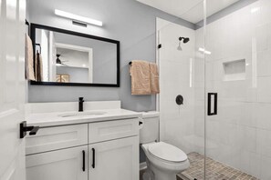 Shower, hair dryer, towels, shampoo