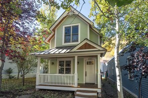 A small, single-story house with a porch, a front door, and a mailbox. - Pacific House | Modern Mountain Elegance Steps from Gondola (Telluride)