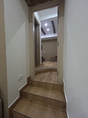 Deluxe Quadruple Room, Balcony, City View | Living area