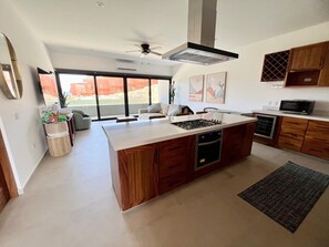 Fridge, microwave, oven, stovetop - Oceanview condo w/ private patio steps to the main beach at Cerritos. Modern 2-bedroom home, a 1-minute walk to the beach, perfect for families or couples looking for quiet luxury and reliable Wi-Fi. (Playa Los Cerritos)