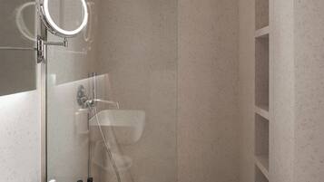 A modern bathroom with a glass-enclosed shower, a vanity with a mirror, and a sink.
