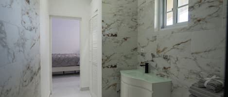 Shower, jetted tub, towels, soap