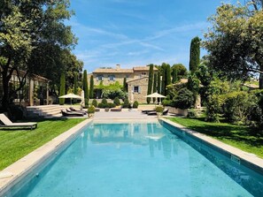 Seasonal outdoor pool, open 8:00 AM to 8:00 PM, pool umbrellas