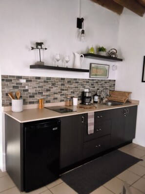 Fridge, stovetop, coffee/tea maker, cookware/dishes/utensils