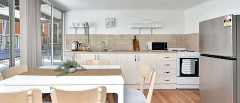 Coffee/tea maker, fridge, microwave, oven