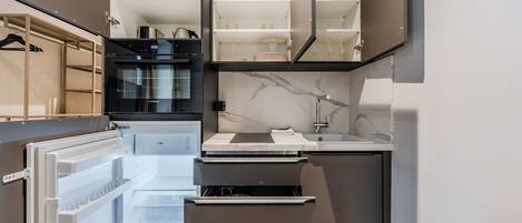 Apartment | Private kitchen | Stovetop, electric kettle, toaster, cookware/dishes/utensils