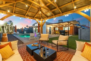 A covered outdoor patio with seating, a pool, and a barbecue area. - 4 Min to Old Town, Heated Pool, Hot Tub, Firepit, Ping Pong, Sleeps 12 (Scottsdale)