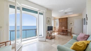 Apartment, 2 Bedrooms, Balcony, Sea View | Living area | 30-inch TV with satellite channels