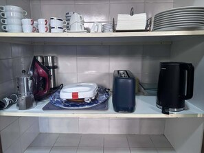 A kitchen with a coffee maker, toaster, and various kitchenware on the counter. - Villa Brisa Beach with Grill & Pool Málaga (La Cala del Moral)