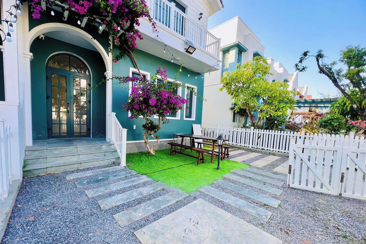 Desk, laptop workspace, blackout drapes, iron/ironing board