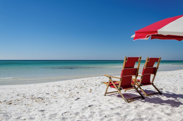 On the beach, sun-loungers