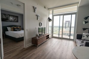 1 bedroom, desk, iron/ironing board, travel crib